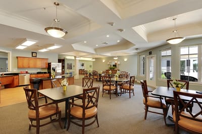 Dining area with tables and chairs in the facility