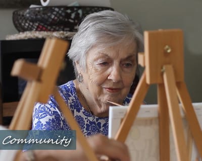 Aldersgate Retirement Community, assisted living in Meridian, MS — Elderly woman painting at an art easel