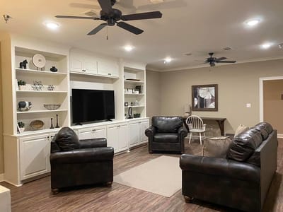 Cozy common area with seating and entertainment unit