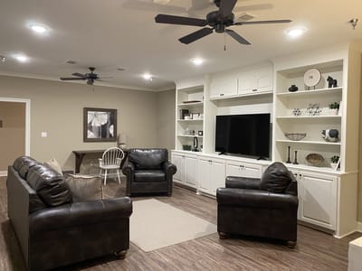 Cozy common area with seating and TV.