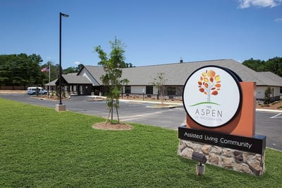 Exterior view of The Aspen of Brookhaven sign and building