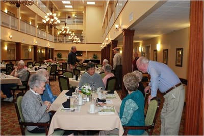 Residents enjoying a meal in the dining room