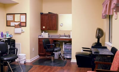 Interior view of a hair salon with chairs and mirrors
