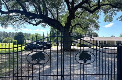 Entrance gate leading to St. Oaks Care Center