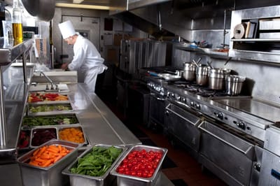Chef preparing meals in a facility kitchen