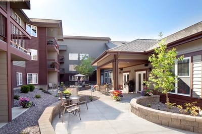 Outdoor courtyard with flowers and seating area