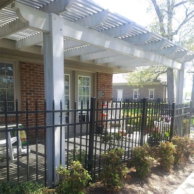 Outdoor seating area with pergola and garden