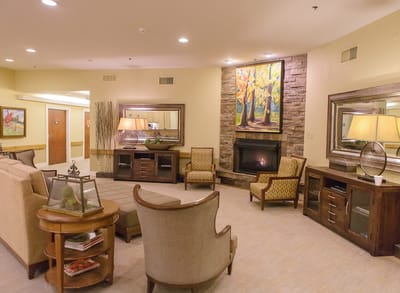 Cozy common area with comfortable seating and artwork