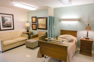 Bright private resident room with comfortable furniture
