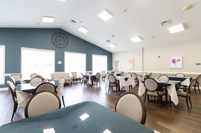 Bright dining area with tables and chairs