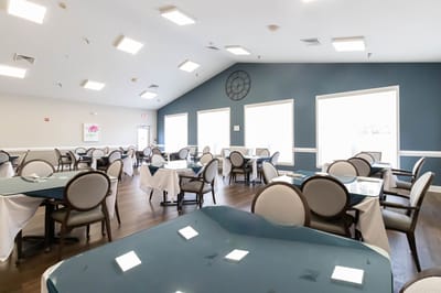 Dining area with tables set and bright lighting