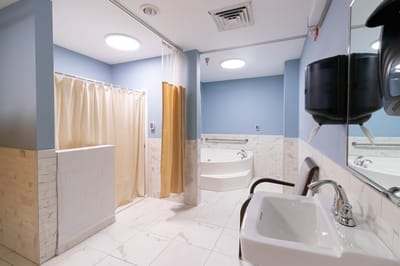 Clean bathroom with modern fixtures and lighting