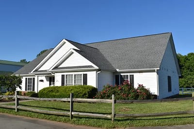 Exterior view of a retirement center building with landscaping