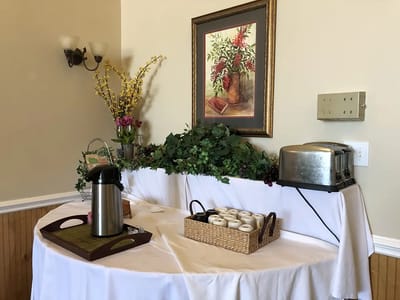 Coffee and pastries displayed on a table in a common area