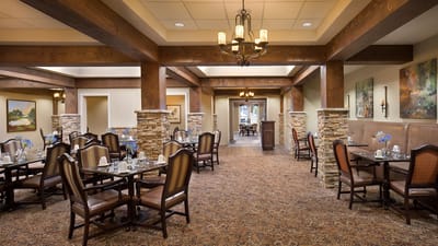 Dining area with elegant wooden furniture and floral decor