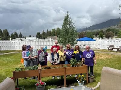 Residents participating in gardening in an outdoor space