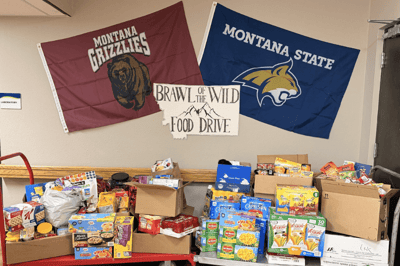 Food drive display with collected food items and banners
