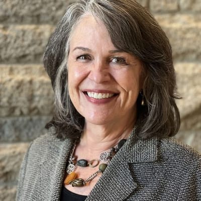 A smiling woman in a professional setting