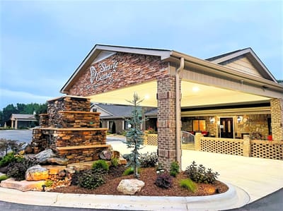 Exterior view of The Shaire Center entrance with landscaping