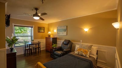 Cozy private room with a bed and furniture
