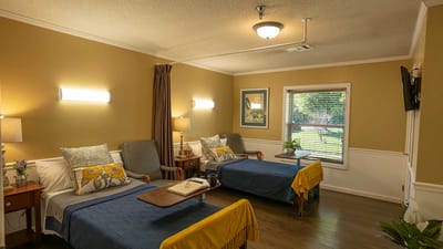 Cozy shared resident room with two beds and natural light