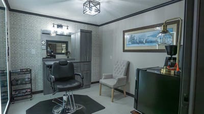 Interior of a salon area with a chair and styling tools