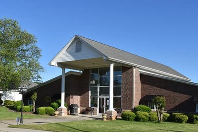 Exterior view of Caremoor Retirement Center building