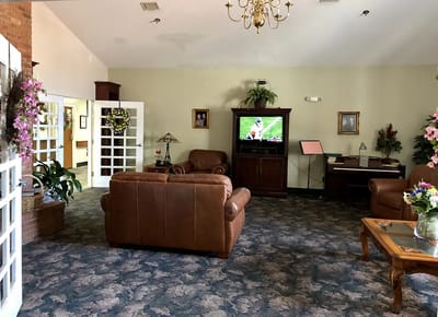 Cozy common area with seating and television