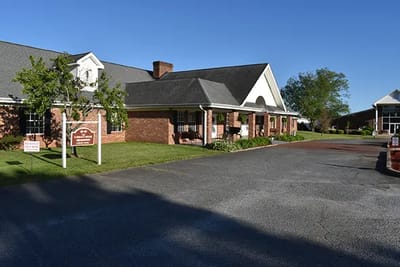 Exterior view of Caremoor Retirement Center building