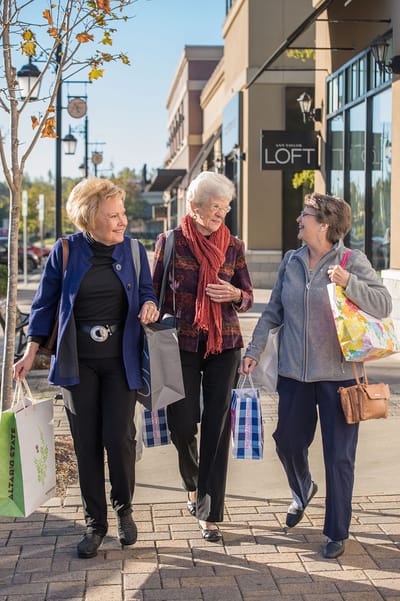 Three women enjoying a shopping day outdoors