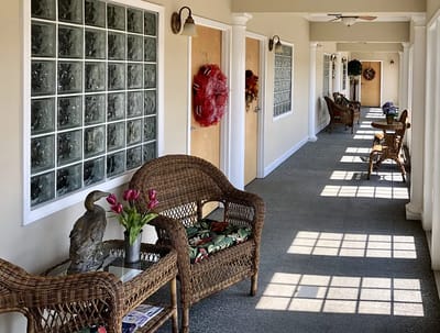 Bright corridor with wicker furniture and decor