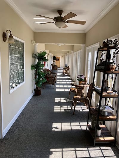 Brightly lit hallway with seating and decor