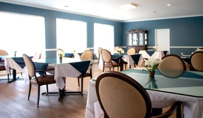 Bright dining room with tables and chairs