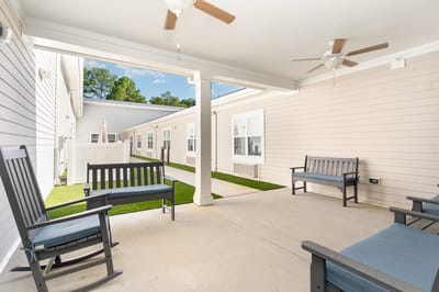 Outdoor seating area with shaded chairs