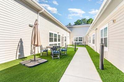 Outdoor courtyard with seating surrounded by buildings