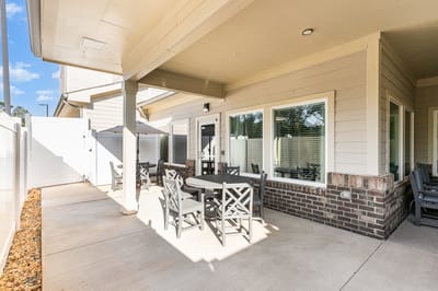 Outdoor seating area with tables and umbrellas