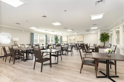 Bright dining room with tables and chairs