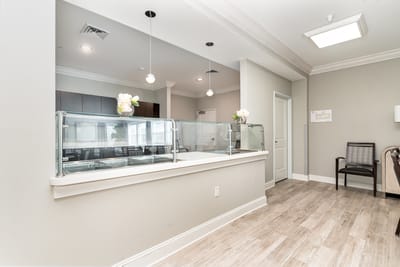 Bright dining area with a service counter and seating