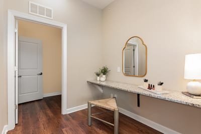 Bright interior space with a vanity and mirror