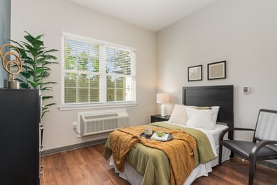 Cozy private resident room with a bed and decor