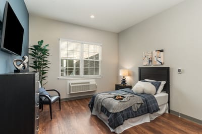A cozy private bedroom with a bed and decorations