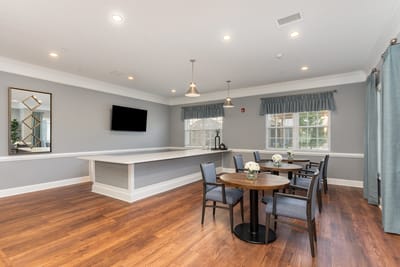 Bright and inviting common area with tables and chairs