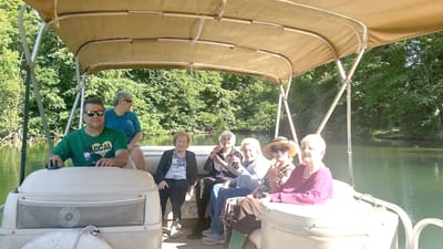 Residents enjoying a boat ride on a sunny day