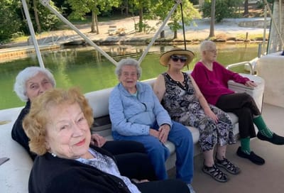 Residents enjoying a boat ride on a sunny day