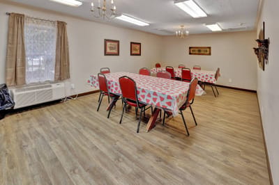 Common area with tables and chairs in an inviting space