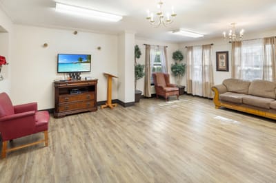 Bright common area with comfortable furniture and TV