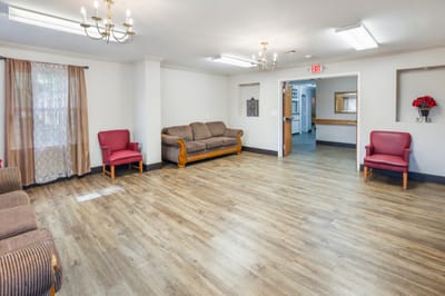 Common area with seating and wooden floor