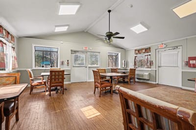 Bright common area with tables and chairs