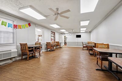 Interior view of a common area with dining tables