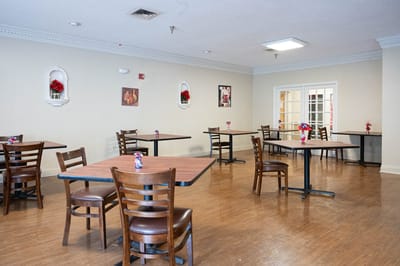 Dining area with tables set for residents